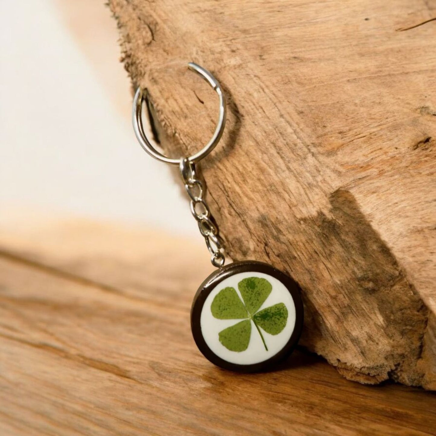 Handmade real four-leaf clover resin keyring, presented with Botanic Gems Jewelry branded packaging