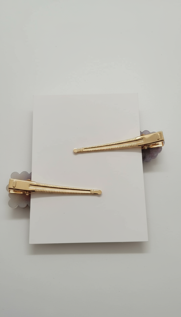 Elegant gold hair clips with purple and white crystal details, back view showing closure system
