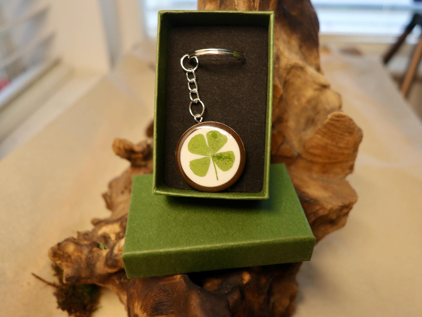 Handmade real four-leaf clover resin keyring, presented with Botanic Gems Jewelry branded packaging