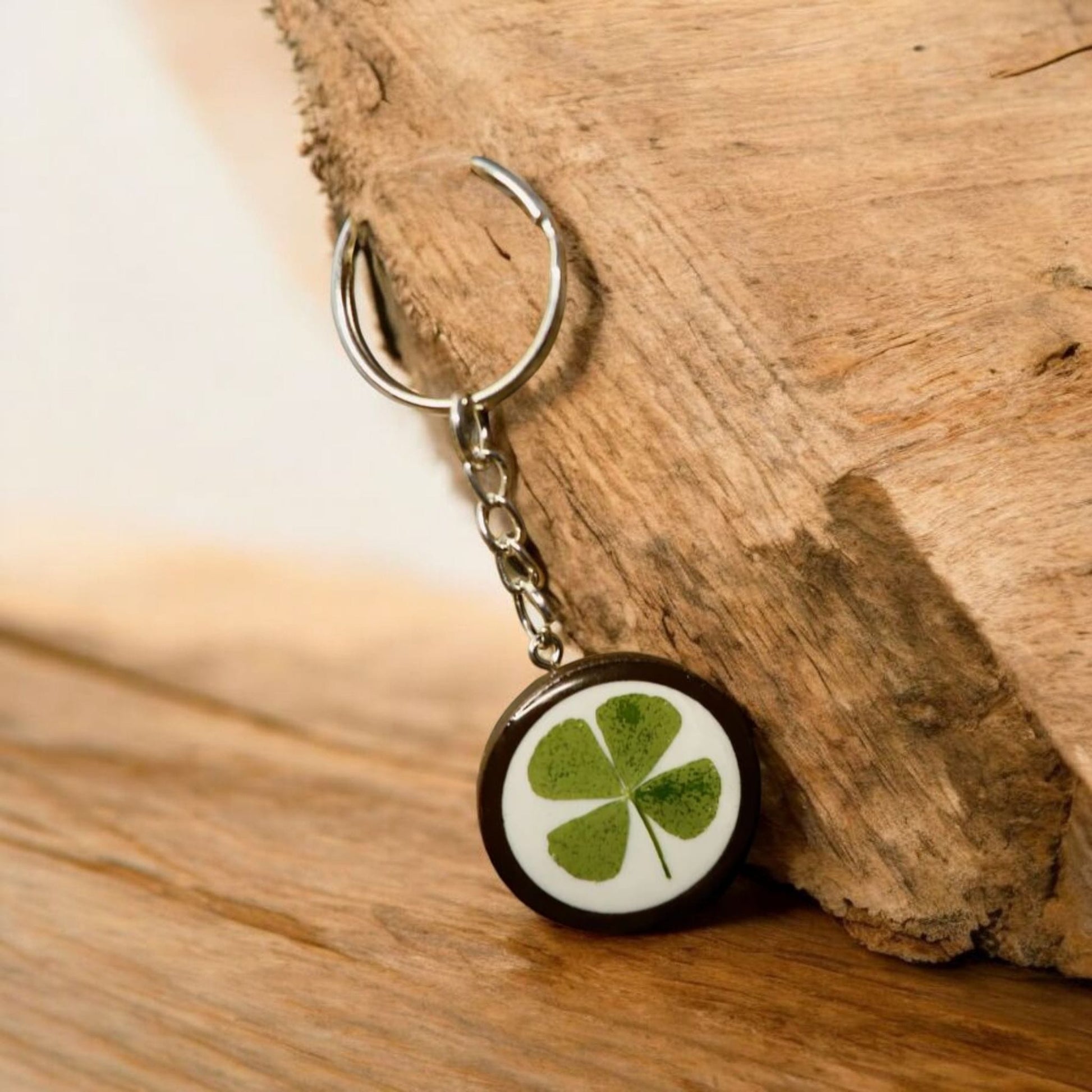 Handmade real four-leaf clover resin keyring, presented with Botanic Gems Jewelry branded packaging