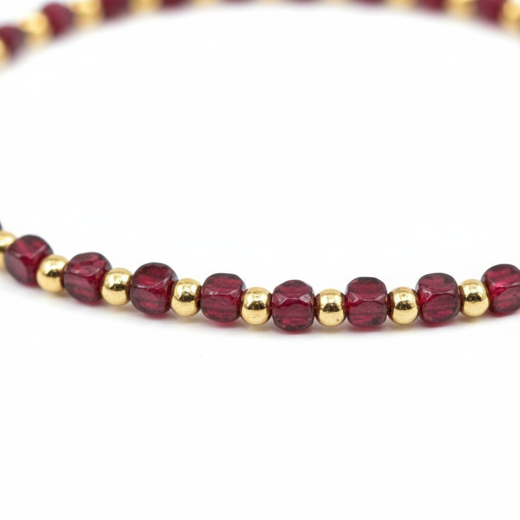 Luxury garnet bracelet arranged in circle on dark velvet dramatic lighting"