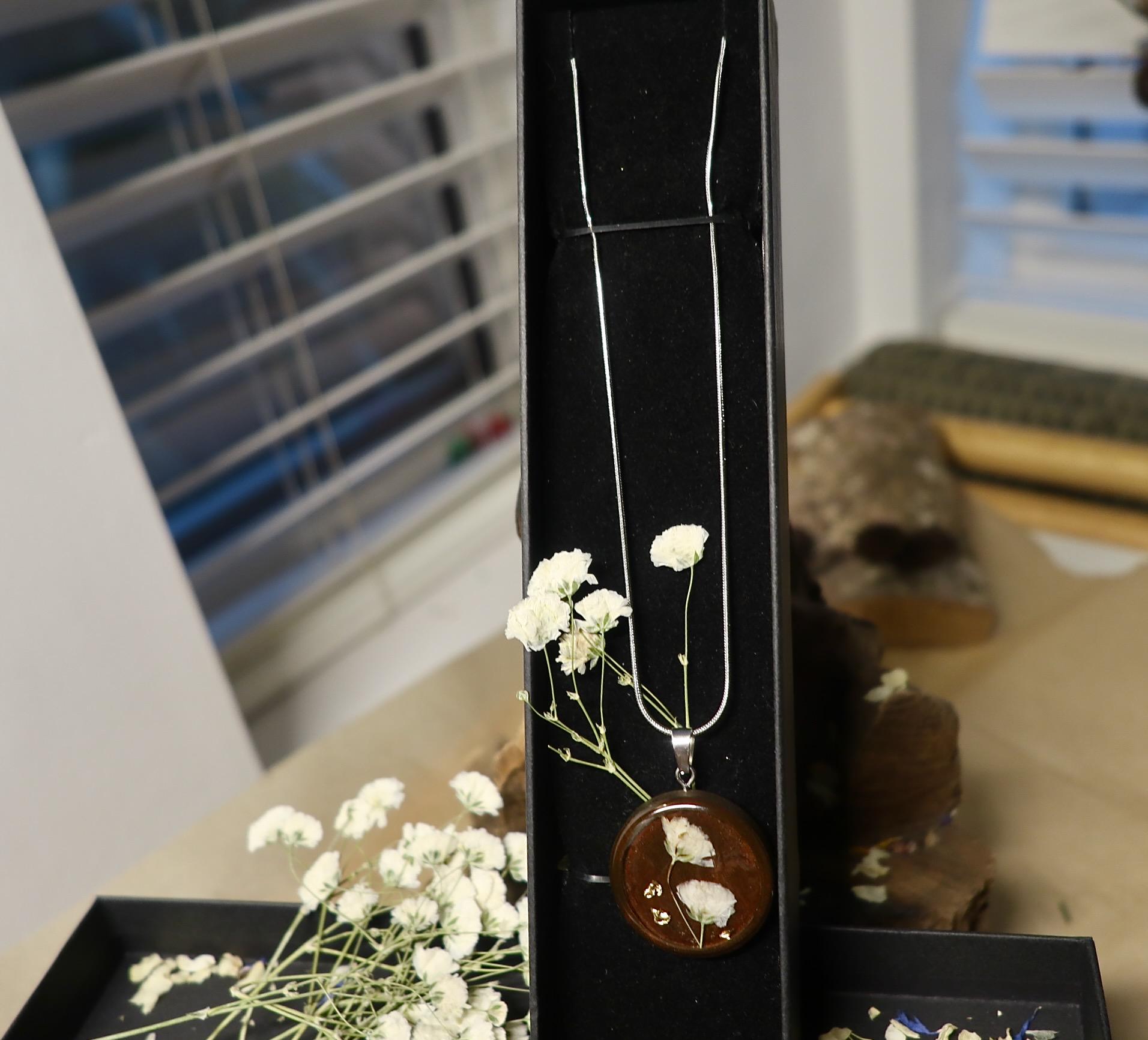 Dried Gypsophila Paniculata (baby's breath) flower jewelry worn on model, showcasing romantic Irish botanical style from Botanic Gems Jewelry