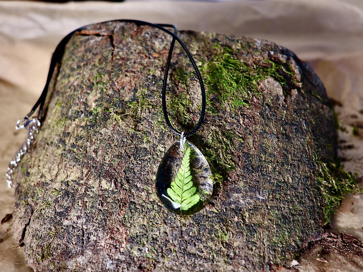 Close-up of delicate real Irish fern detail preserved in clear resin, handmade by Botanic Gems Jewelry