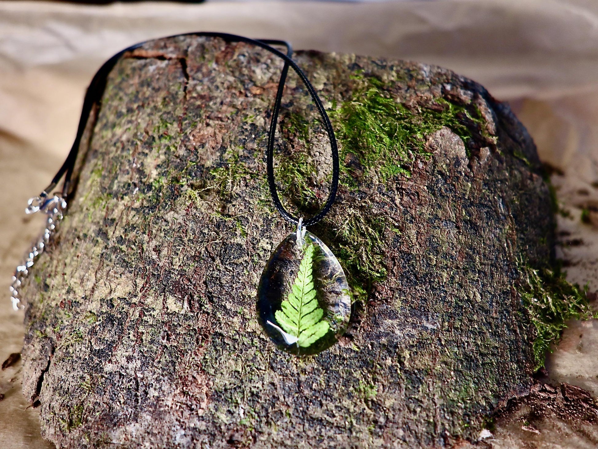 Close-up of delicate real Irish fern detail preserved in clear resin, handmade by Botanic Gems Jewelry