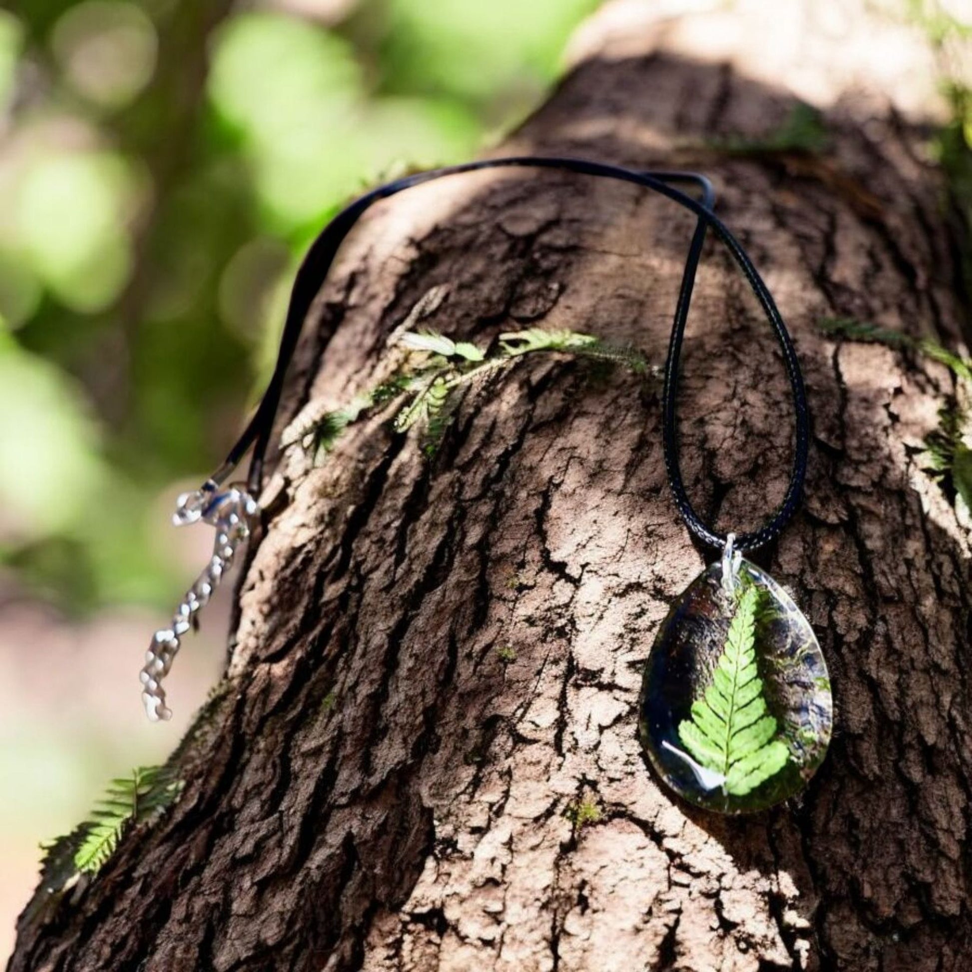 Handmade real Irish fern resin jewelry displayed with Botanic Gems Jewelry branded packaging