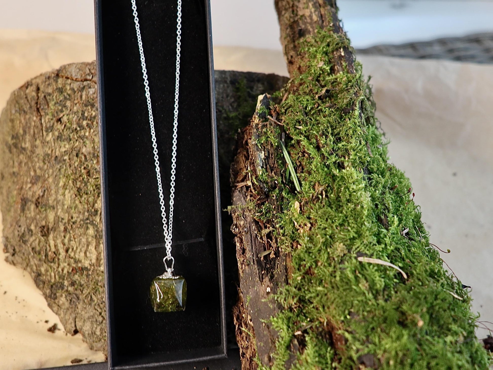 Close-up of real Irish moss pendant worn on a chain, highlighting natural textures in resin by Botanic Gems Jewelry