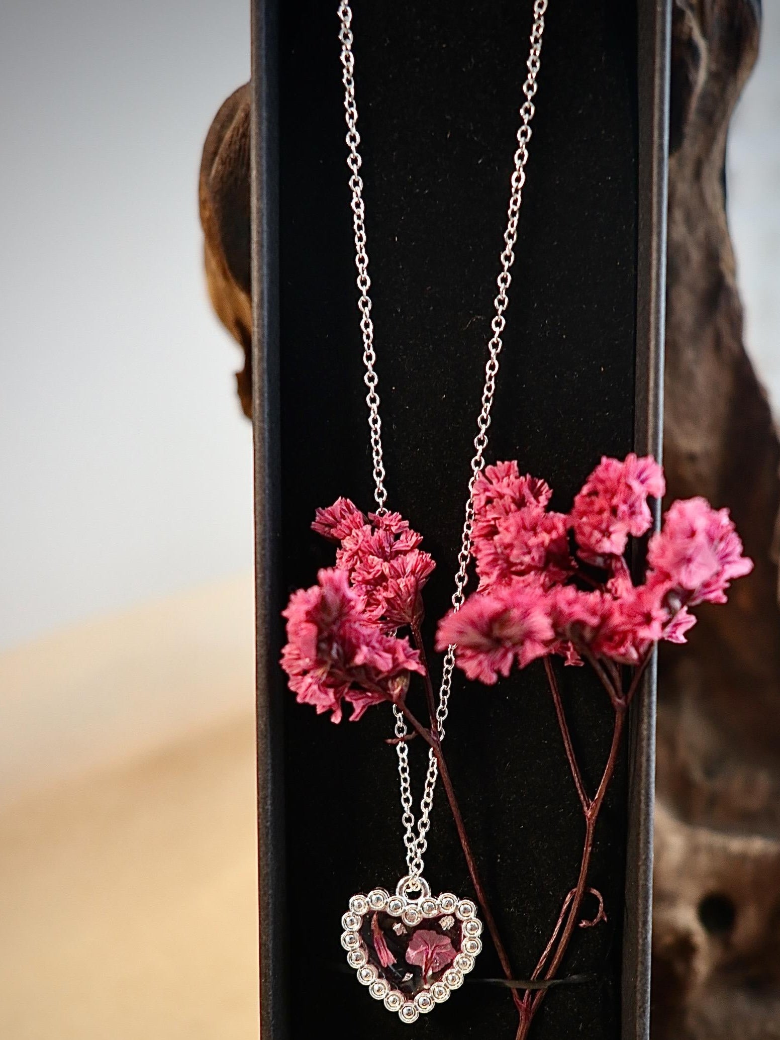 "Dried pink limonium flower jewelry worn, showcasing elegant Irish botanical style from Botanic Gems Jewelry