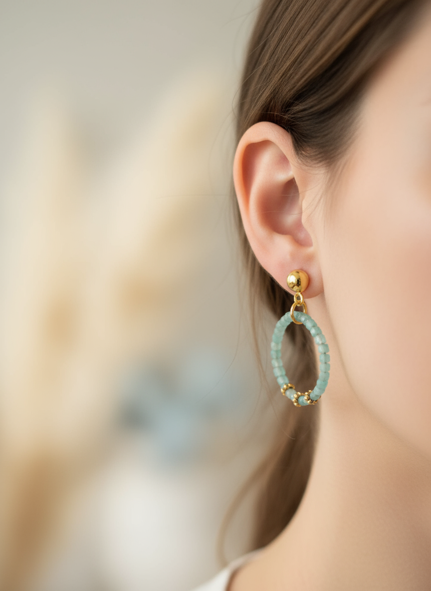 Aquamarine beaded hoop earrings worn on ear - 2cm gold stainless steel circle earrings